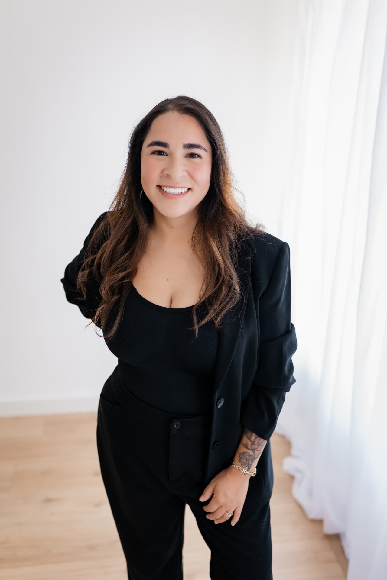 Isabel, boutique event and wedding coordinator, standing and smiling